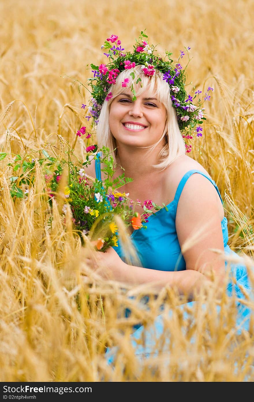 Woman in wreath of flowers