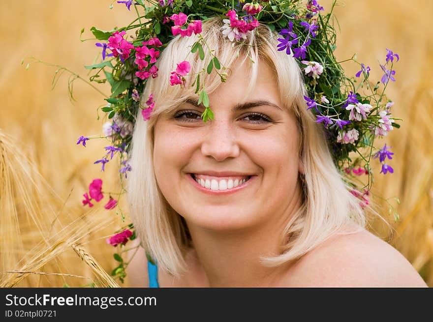 Woman in wreath of flowers