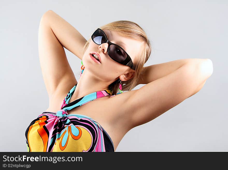 Portrait of girl with sun glasses in studio