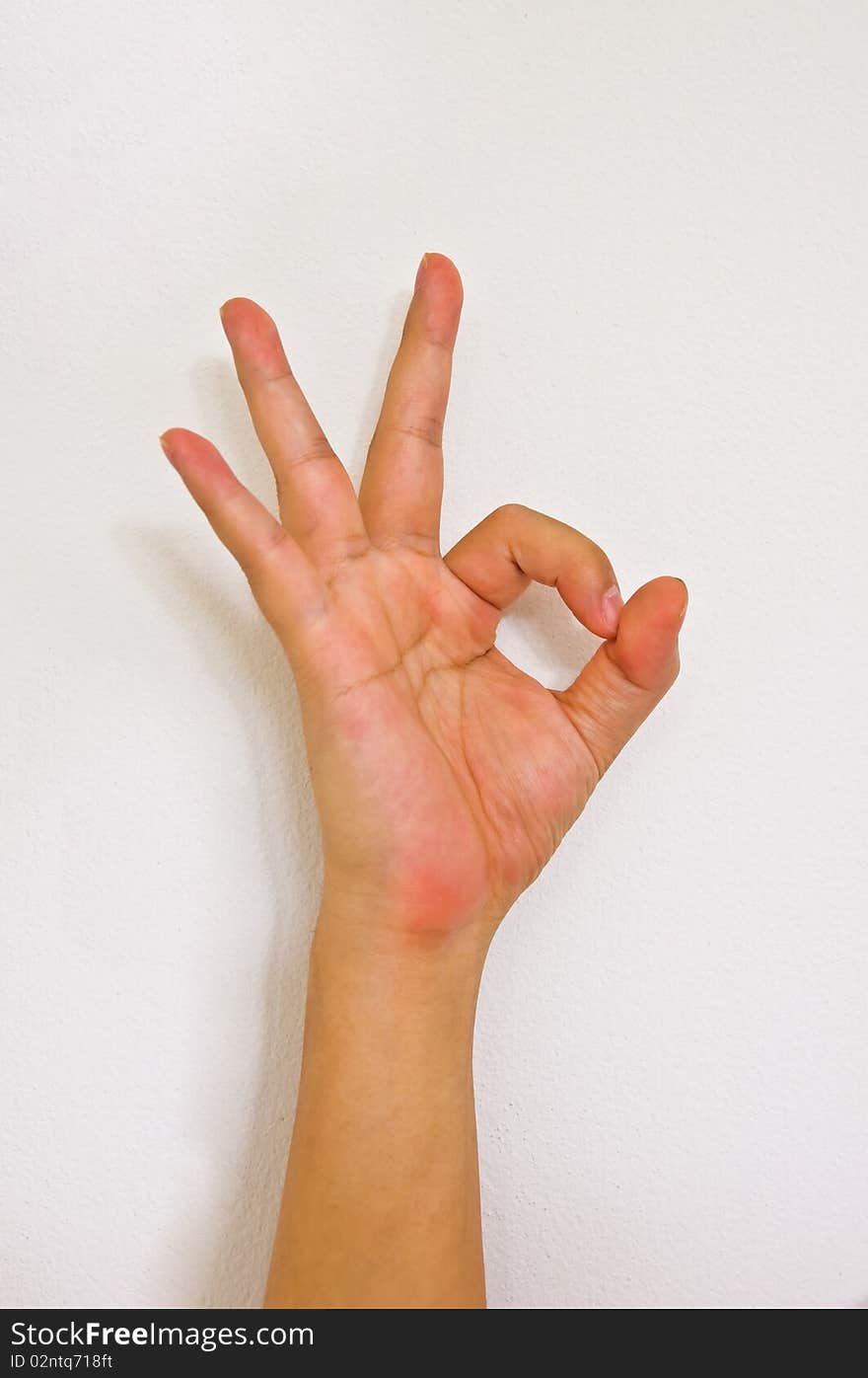Hand sign OK white isolation
