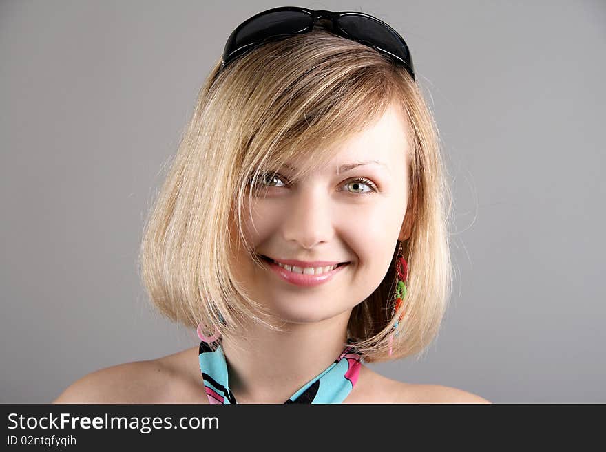 Portrait of girl with sun glasses in studio