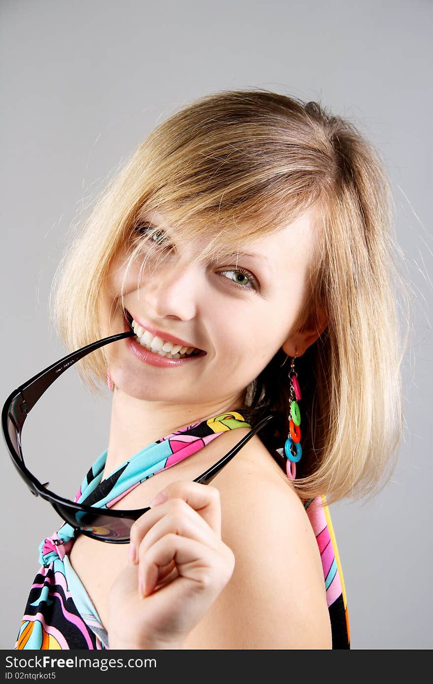 Portrait of girl with sun glasses in studio