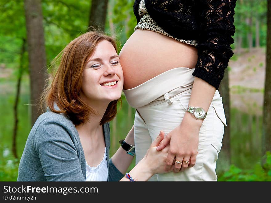 Girl Listening Pregnant Belly