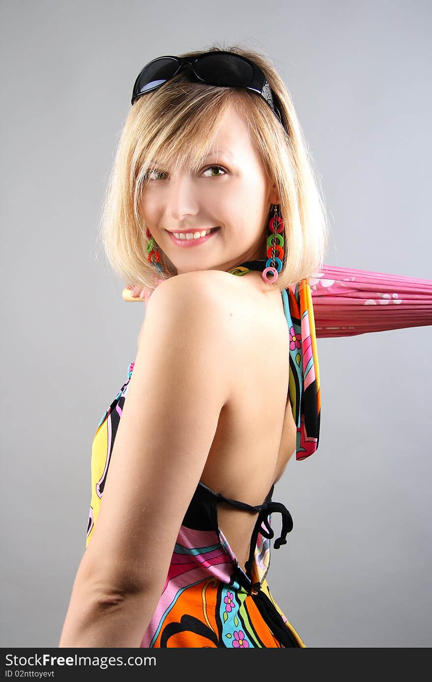 Portrait of girl with pink umbrella