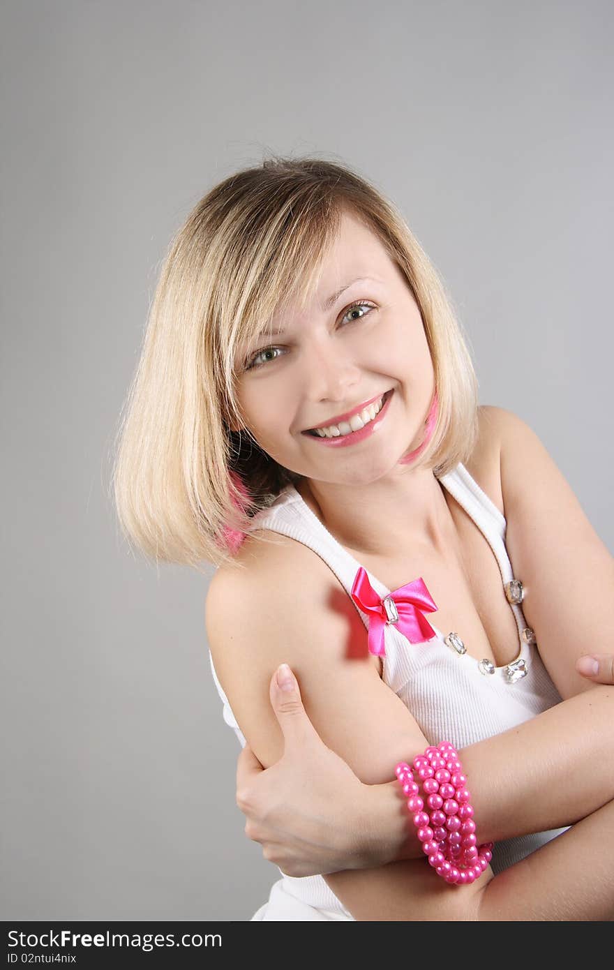 Portrait of merry pretty glamourous girl in studio