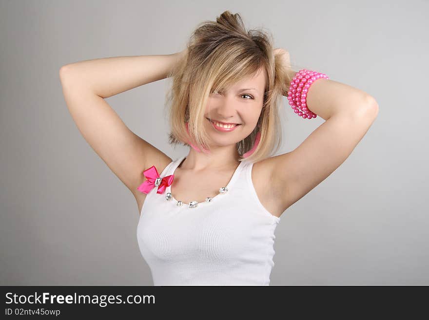 Portrait of merry pretty glamourous girl in studio