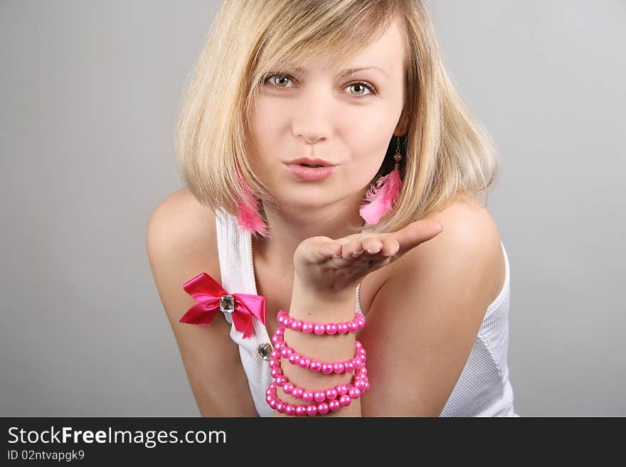 Portrait of merry pretty glamourous girl in studio