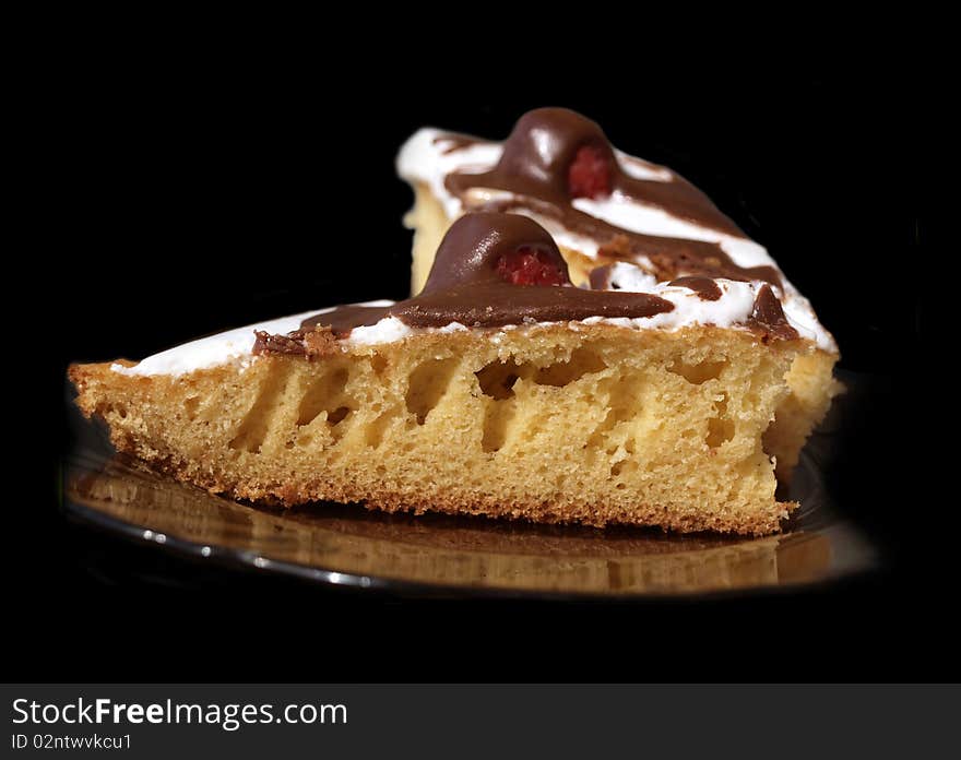 delicious raspberry pie with a couverture on a black background