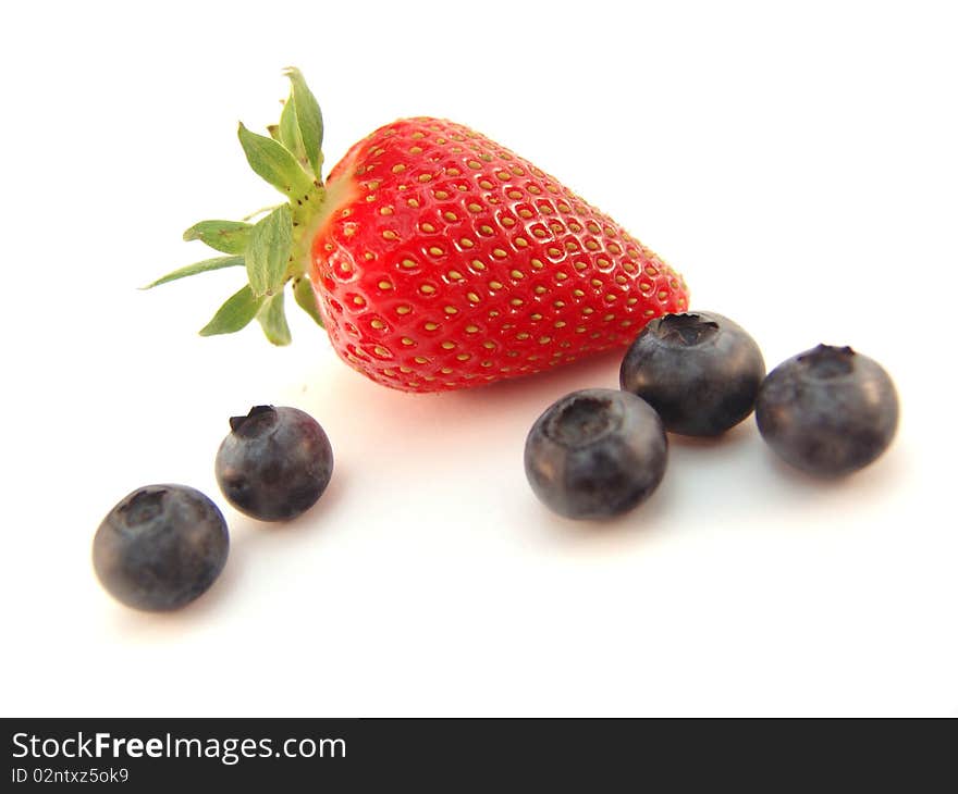 Strawberry and blueberries isolated over white background