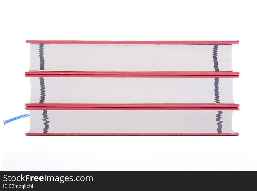 Three red books against white background