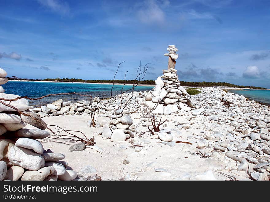 Stones balanced on a strip of white sand venezuela. Stones balanced on a strip of white sand venezuela