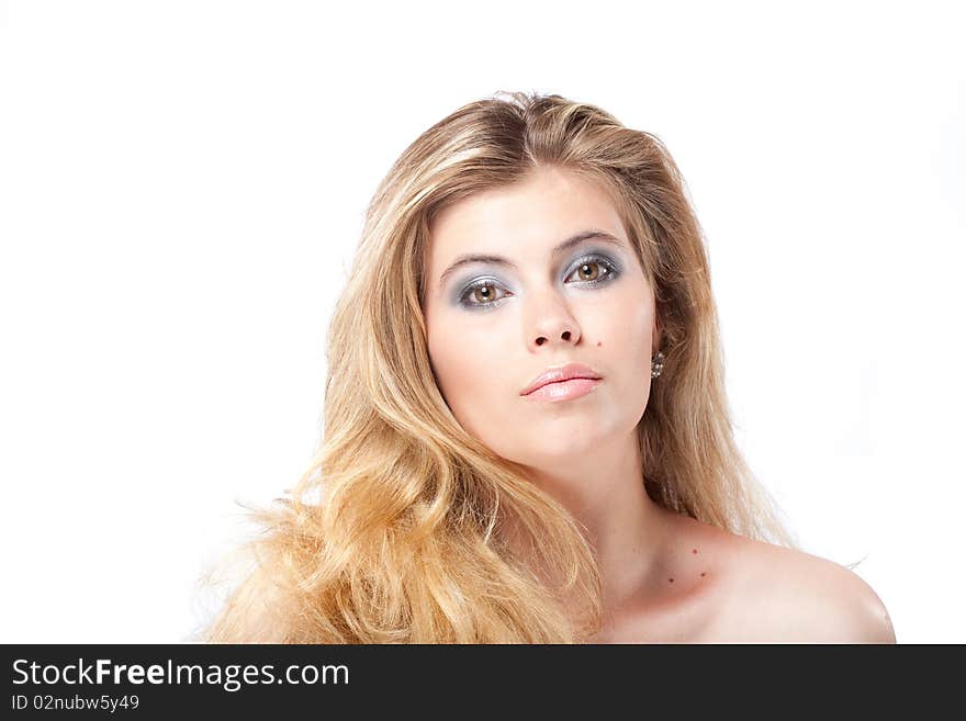 Closeup portrait of beautiful young elegant woman with large grey eyes and healthy blonde hair