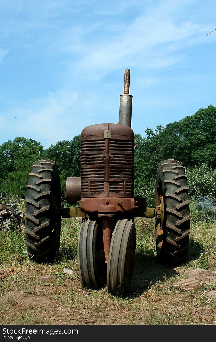 A Old rusty farm tractor