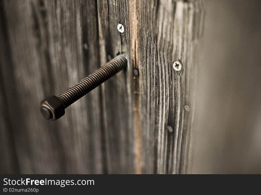 An old wood bolt, aged by the years but remaining resolute