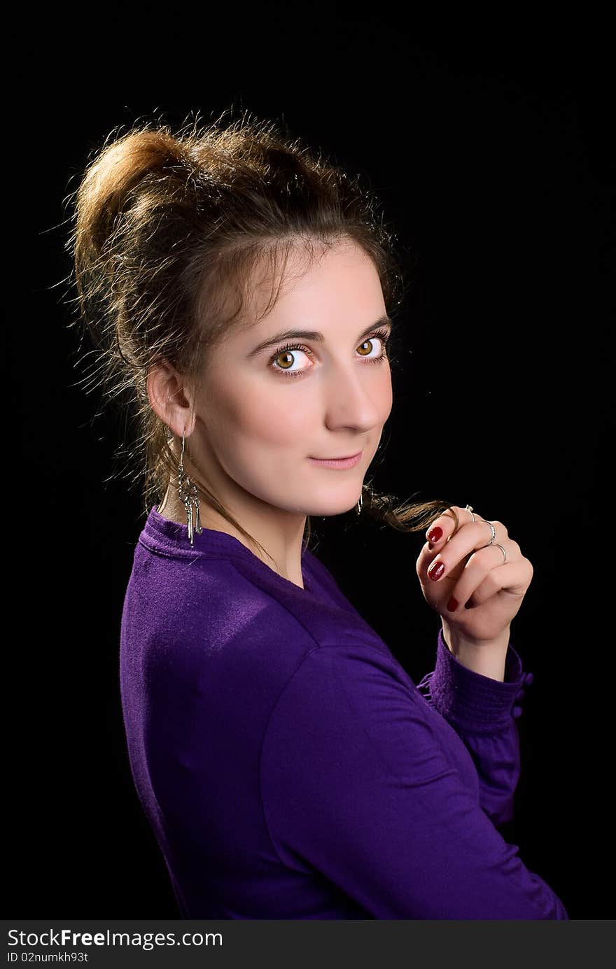 Portrait of a beautiful young woman. Black background. Studio shot. Portrait of a beautiful young woman. Black background. Studio shot.