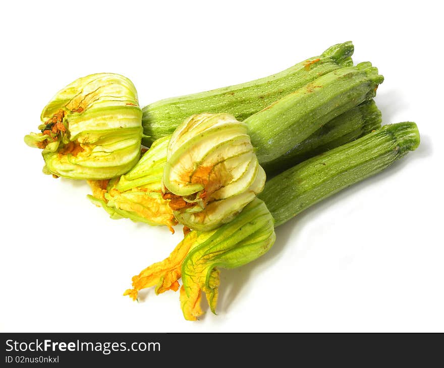 Courgettes(zucchini) with edible flower isolated on white background