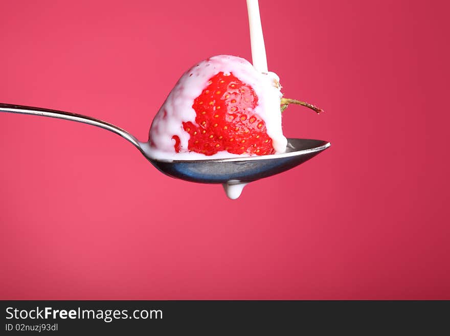 Close-up view of fresh strawberry with cream. Close-up view of fresh strawberry with cream