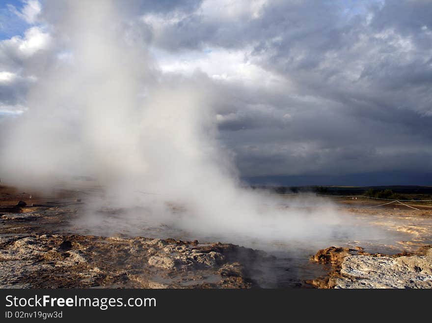 Geothermal area in Geysir region in Iceland. Famous geyser Stokkur just after the eruption.