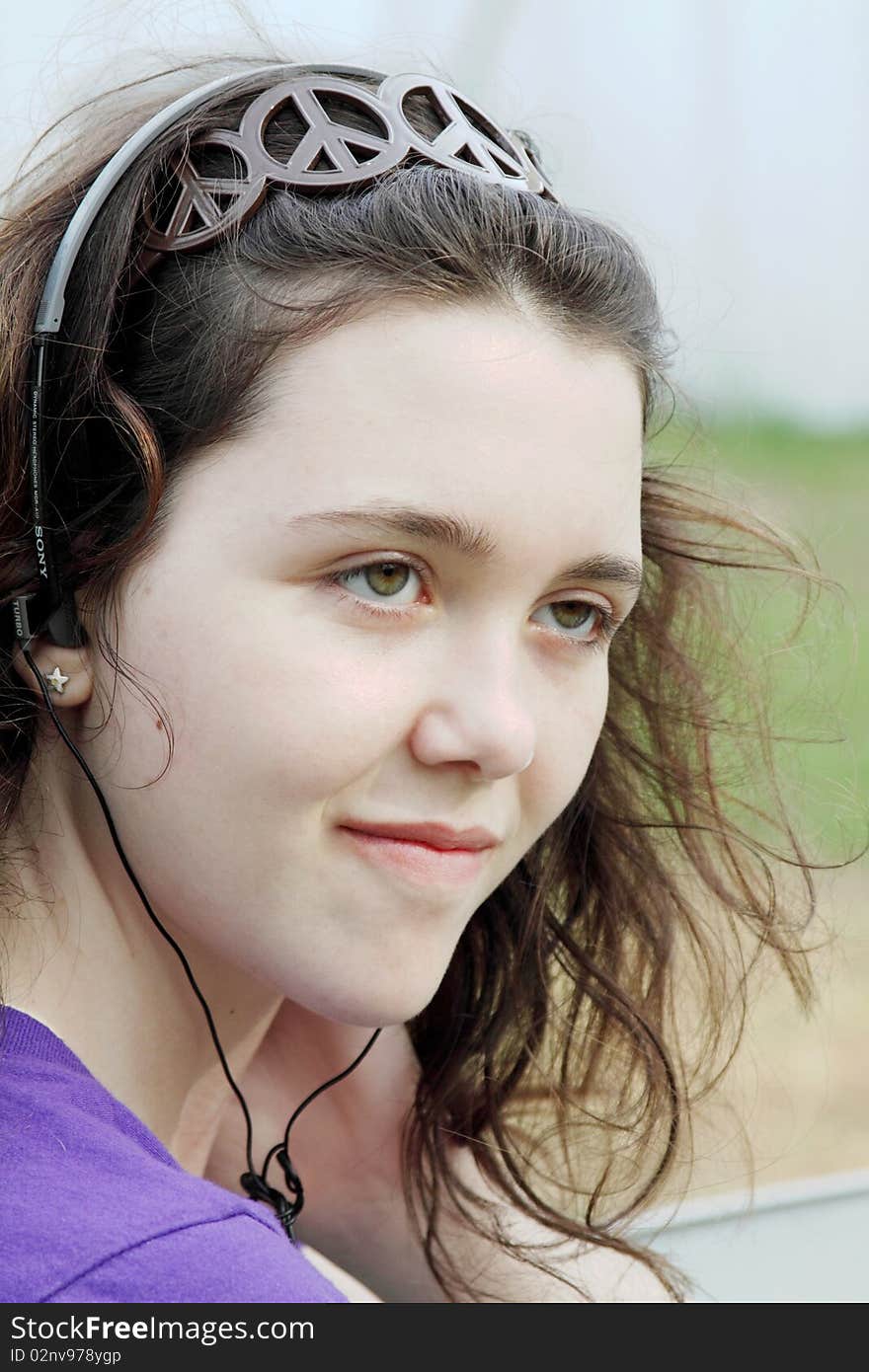 Young beautiful women smiling listening to music. Young beautiful women smiling listening to music