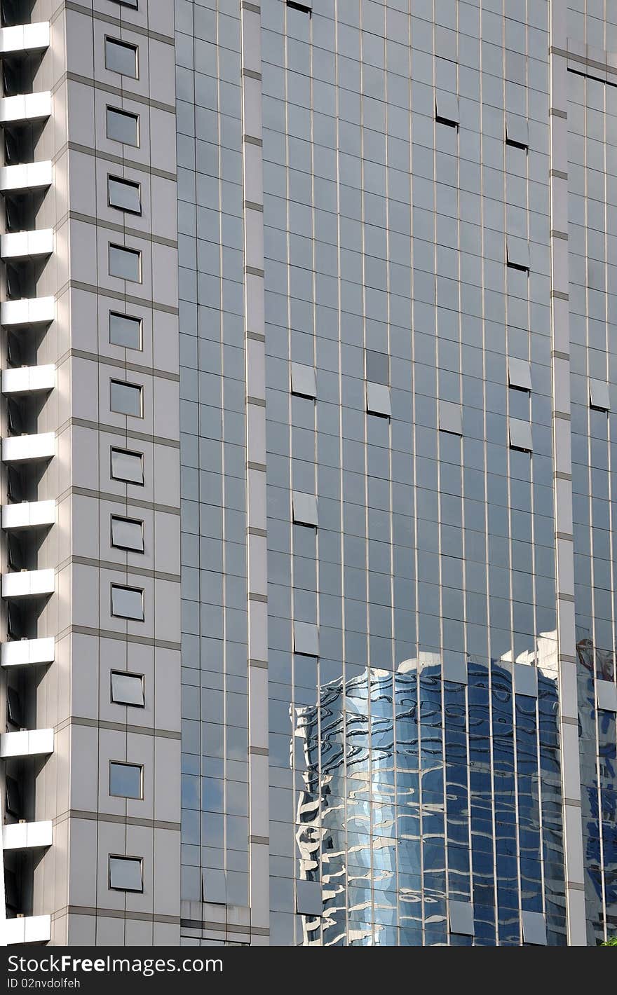 Geometric pattern and reflection image on external glasses wall of modern building. Geometric pattern and reflection image on external glasses wall of modern building.