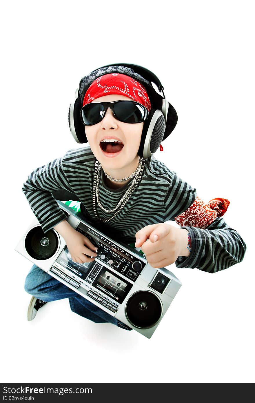 Shot of a trendy teenager listening to music in headphones. Isolated over white background.