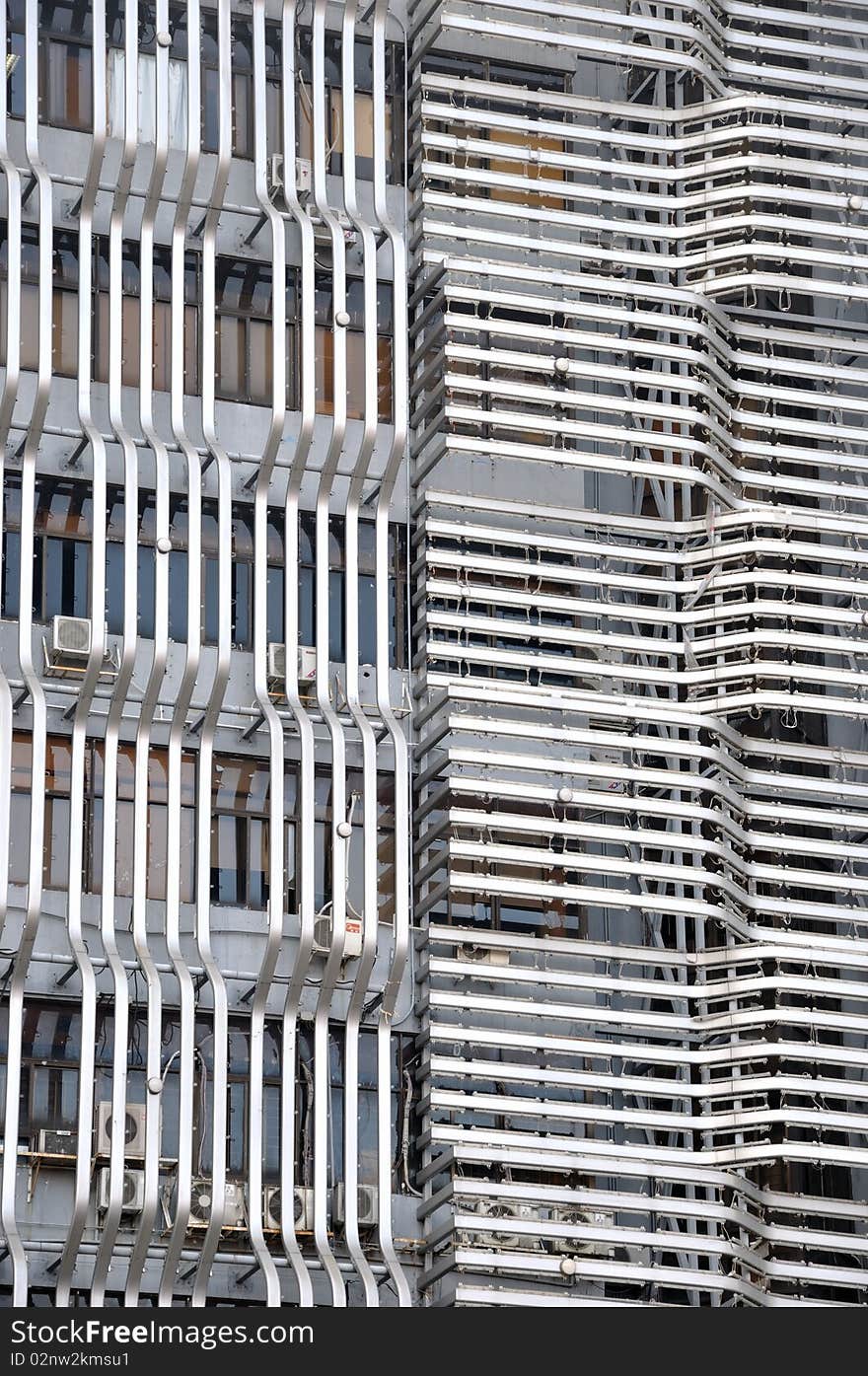 External wall decoration of modern building, with horizontal and vertical metal grid, shown as geometry and three dimension. External wall decoration of modern building, with horizontal and vertical metal grid, shown as geometry and three dimension.