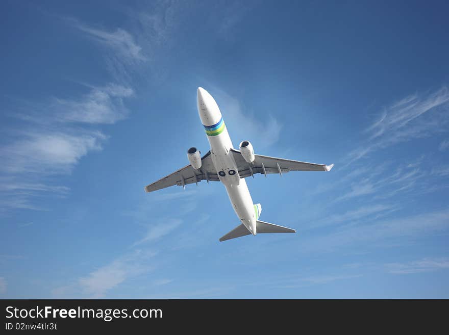 Airplane flying against a blue sky