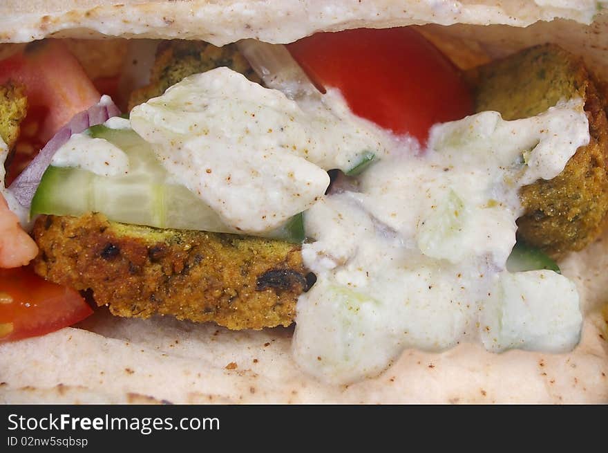 Traditional falafel pocket bread sandwich with salad