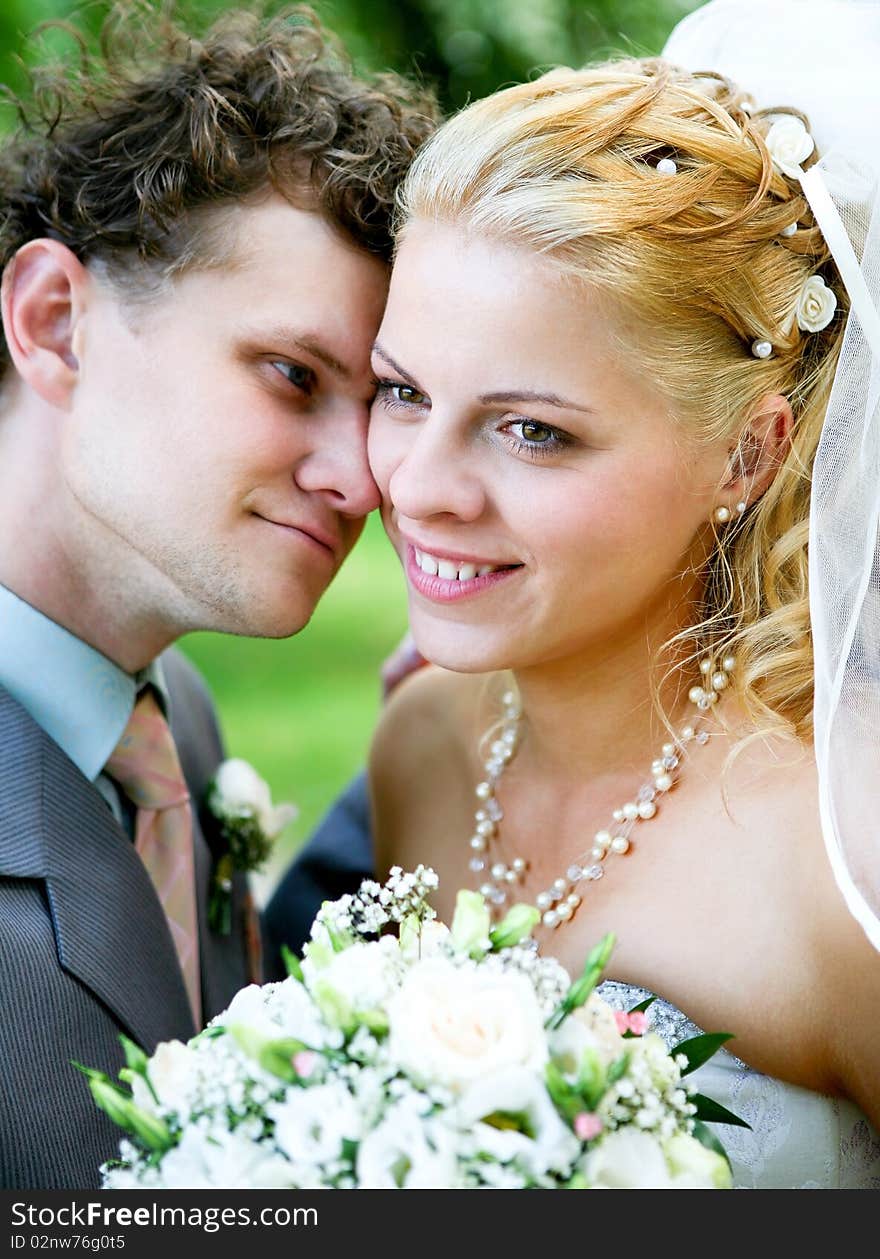 Photo session of the newlyweds walking in the park