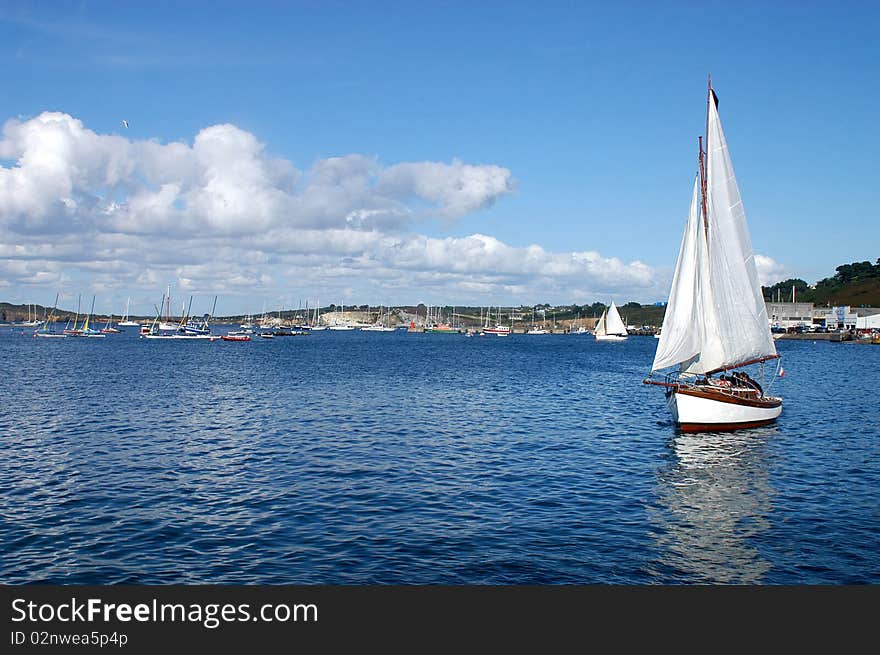 A Sailboat Enters The Harbor Camaret-France