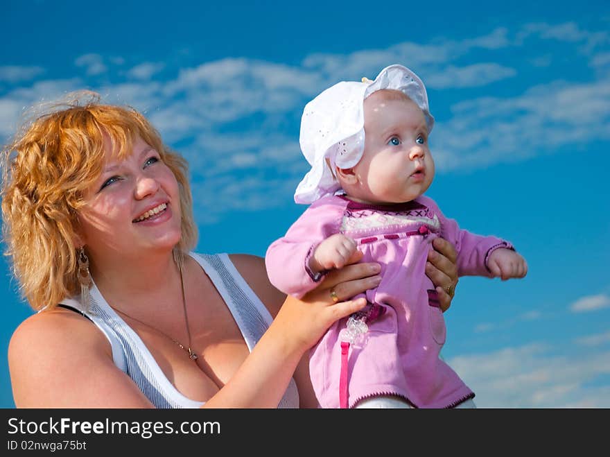 Baby in mothers arms at summer season. Baby in mothers arms at summer season