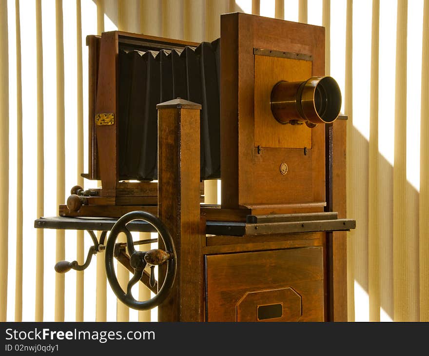 Antique mahogany wood studio camera on rolling stand