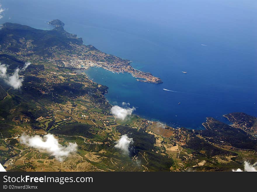 Italy, Island of Elba, to the front at Tuscany,in the Mediterranean Sea, view of the aeroplane. Italy, Island of Elba, to the front at Tuscany,in the Mediterranean Sea, view of the aeroplane