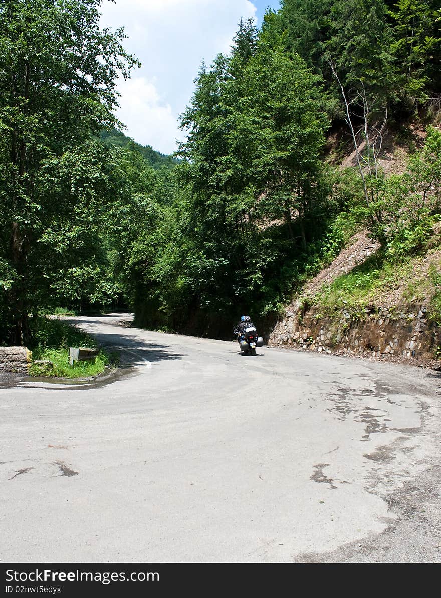 Motorcycle on trecherous mountain road. Motorcycle on trecherous mountain road