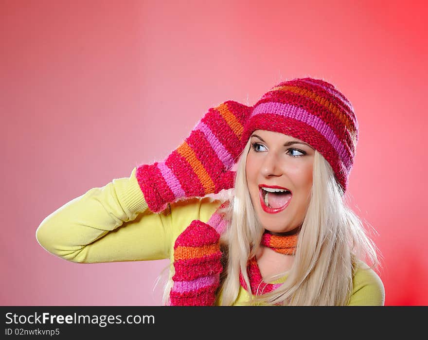 Seasonal portrait of pretty funny woman in hat and gloves screaming. Seasonal portrait of pretty funny woman in hat and gloves screaming