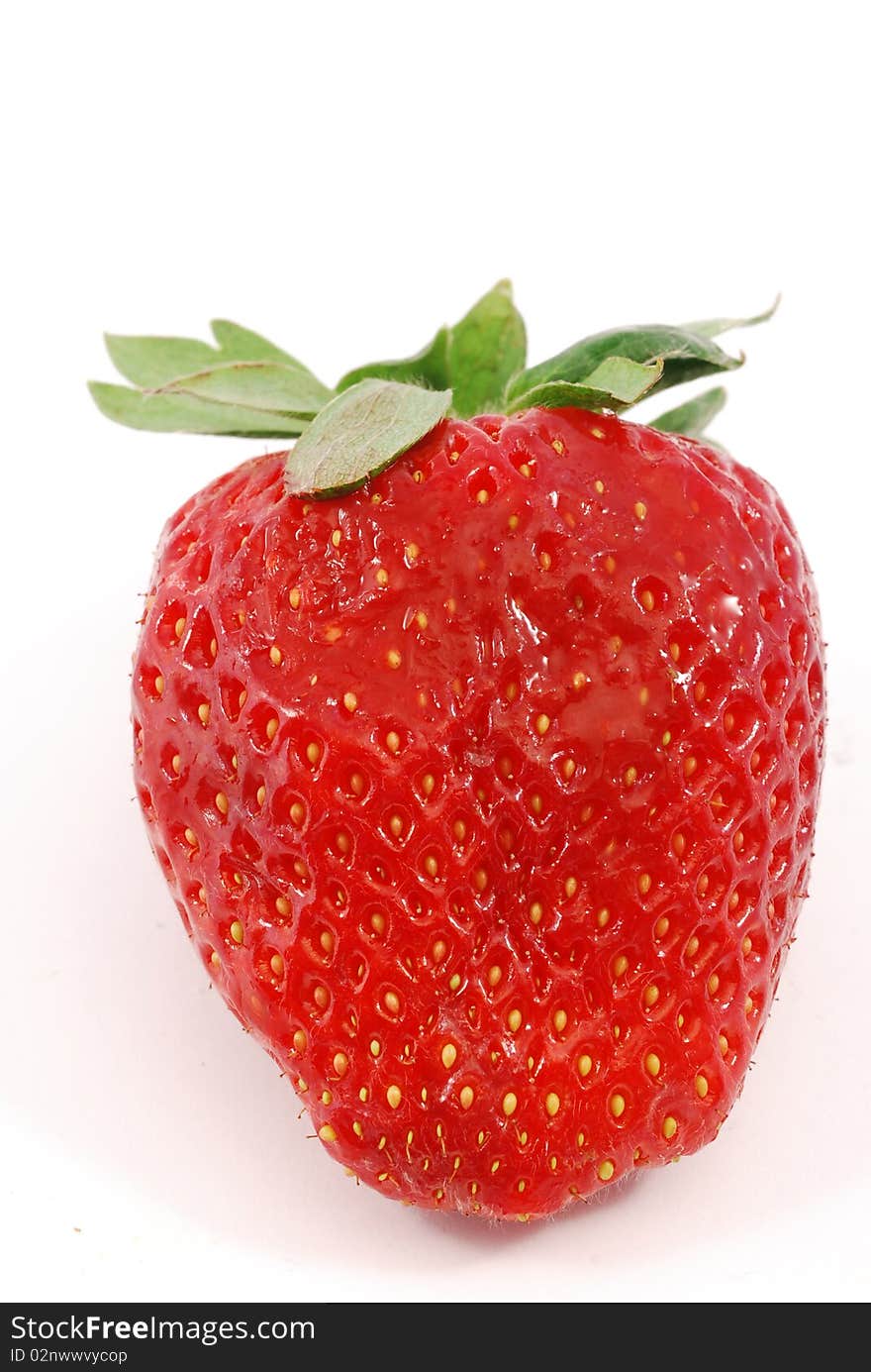 Strawberry in the foreground on white background. Strawberry in the foreground on white background