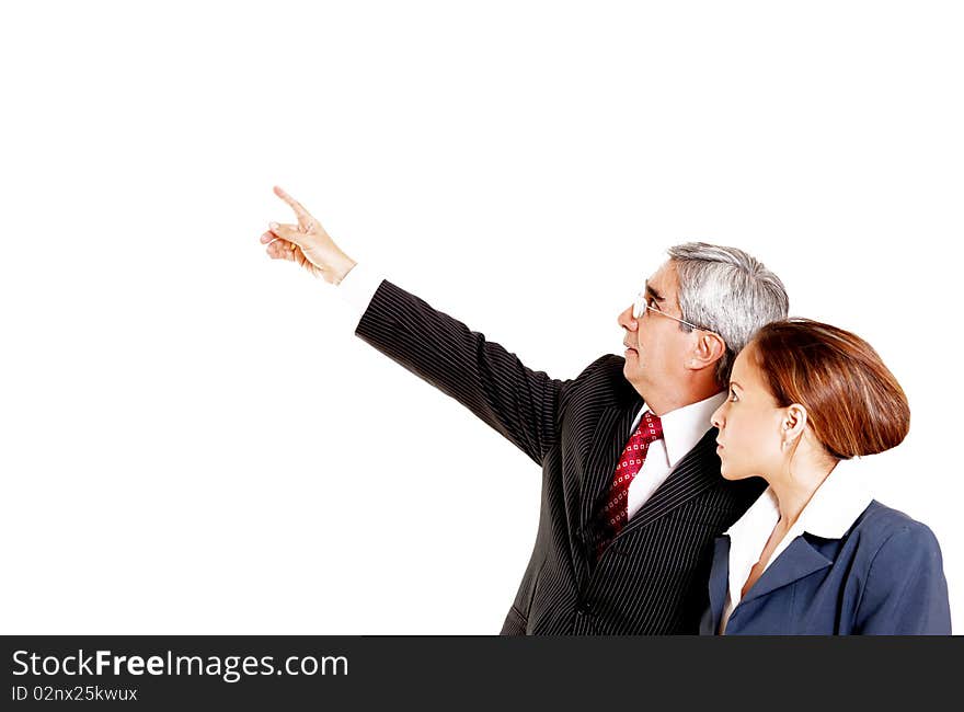 Businessman and businesswoman looking up over white background