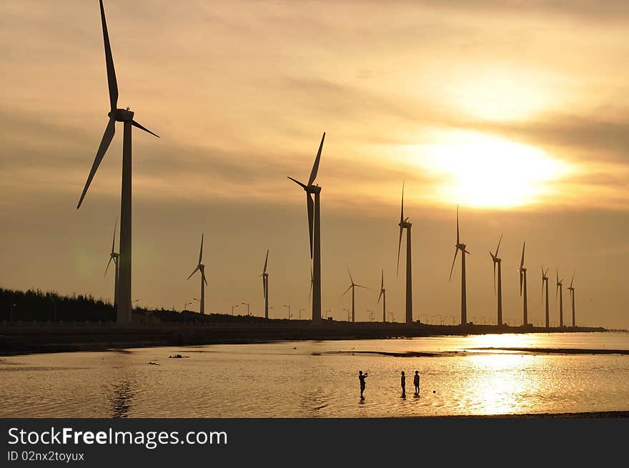 A golden sunset at the wind-power station. A golden sunset at the wind-power station