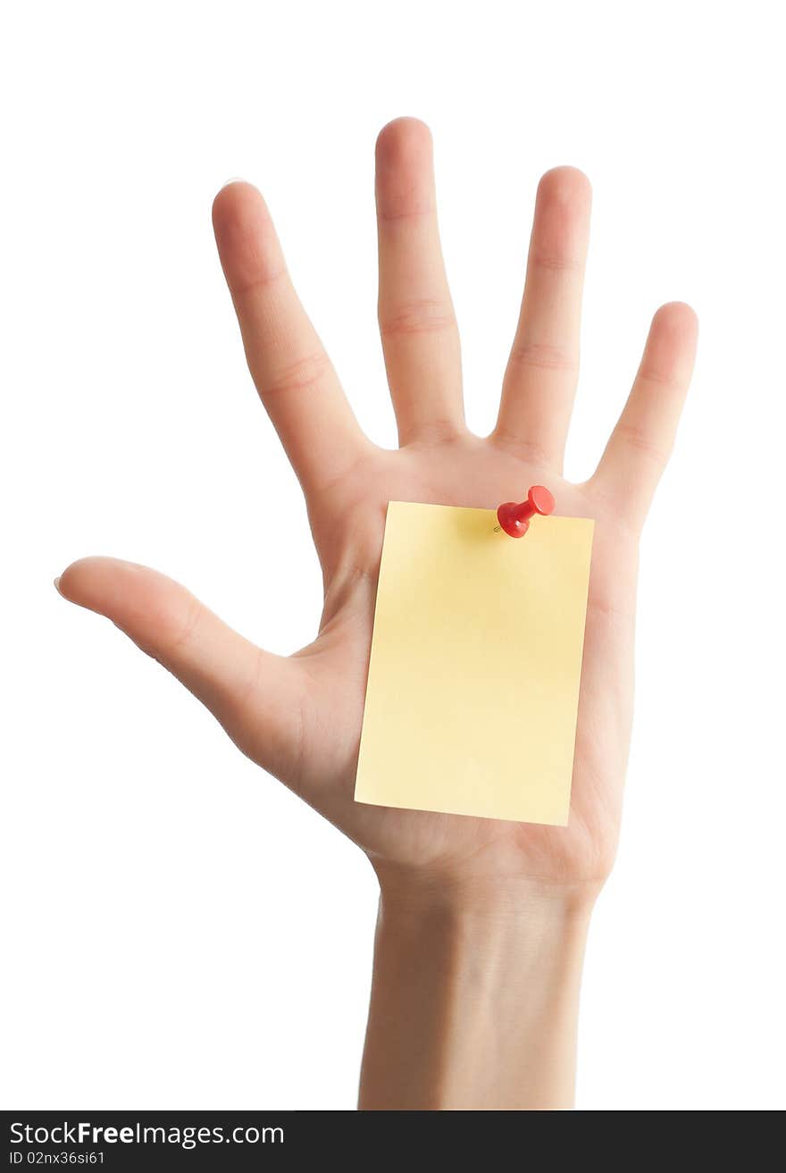 Female hand with sticky office note isolated on white background . Note is blank and yellow. Female hand with sticky office note isolated on white background . Note is blank and yellow