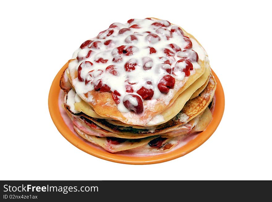 Pancakes with cherries on white background.Isolate with path