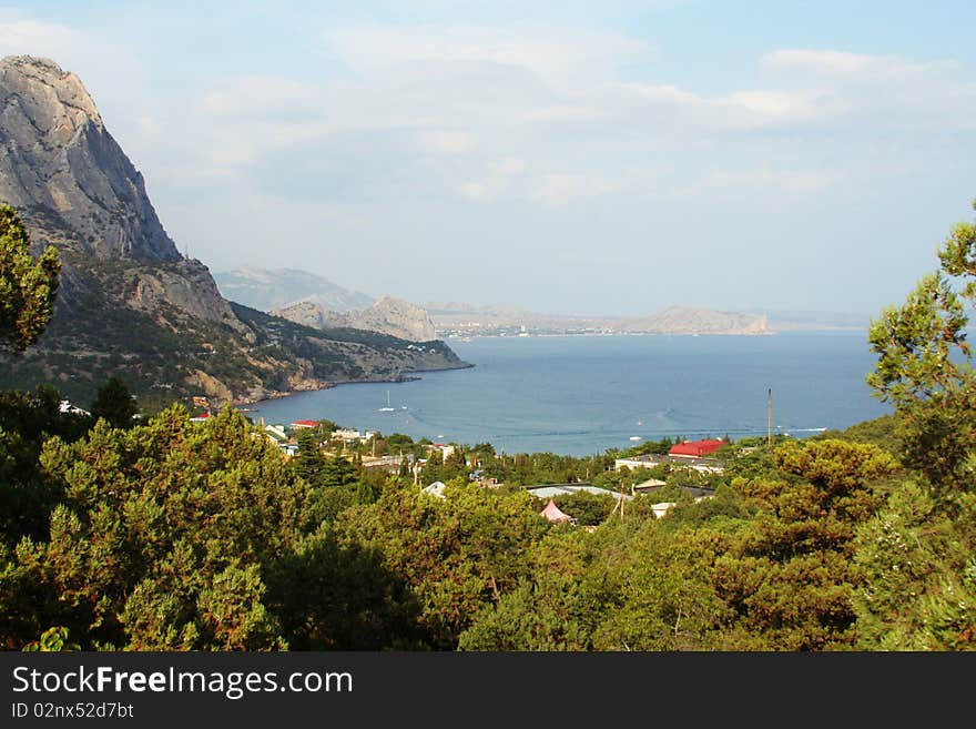 Rocks of the Black Sea coast. Crimea. New. The roofs of the city. Rocks of the Black Sea coast. Crimea. New. The roofs of the city