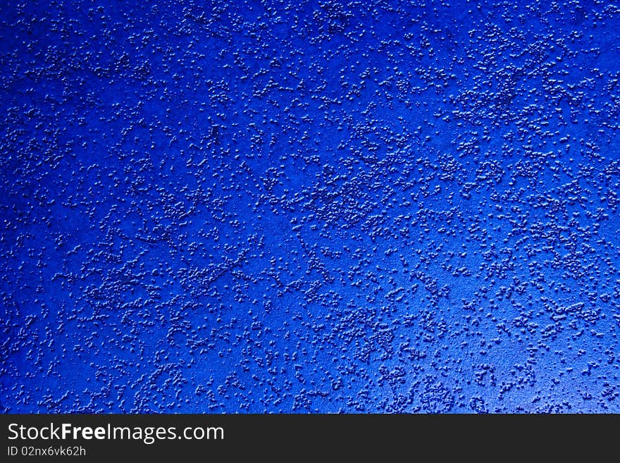 A unique looking of a deep blue wall paper.