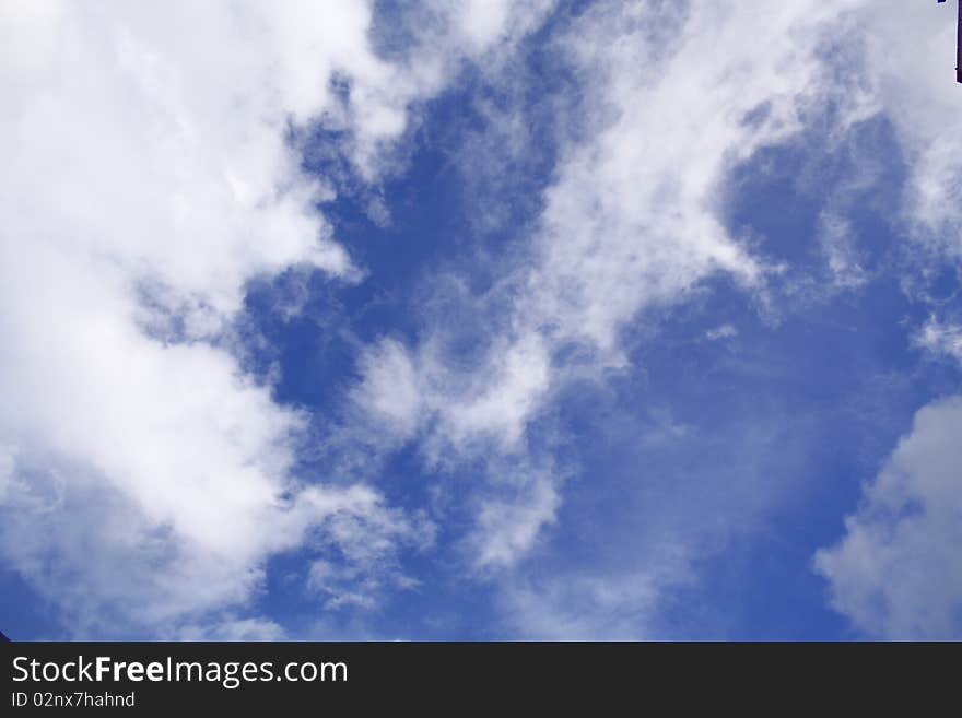 A a cloudscape with abstract patterns that seem to be slowly merging into each other. A a cloudscape with abstract patterns that seem to be slowly merging into each other.