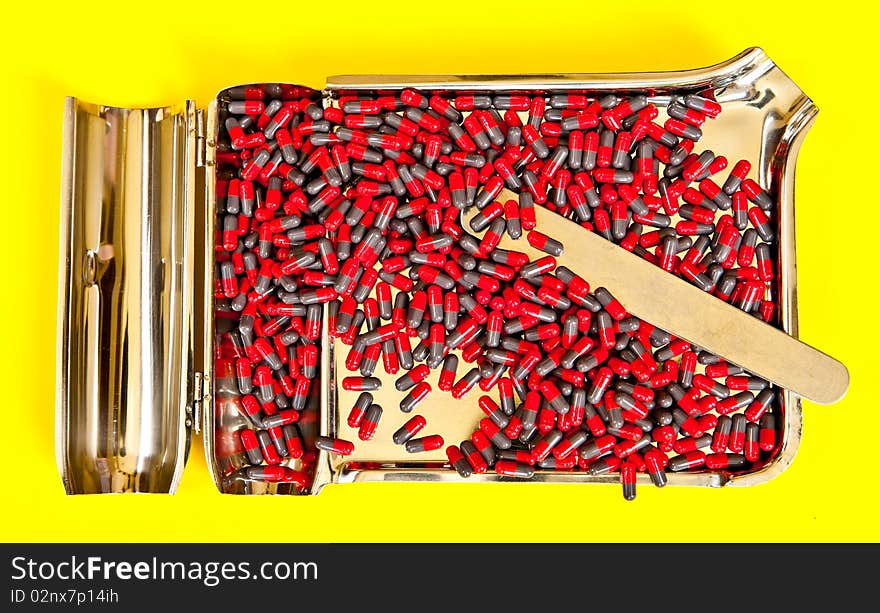 A capsules on a stainless steel tray, ready for counting. A capsules on a stainless steel tray, ready for counting.