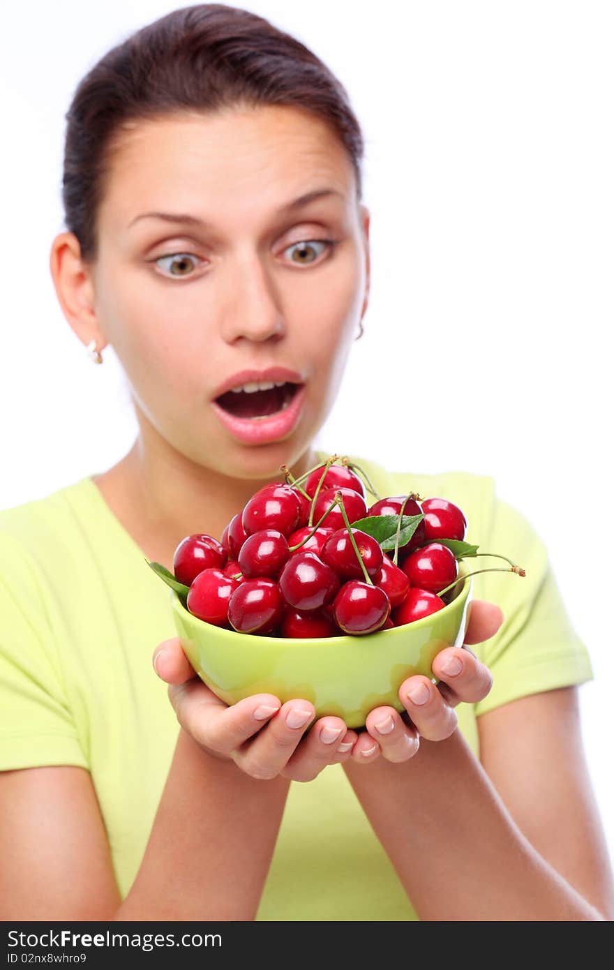 Surprised young woman with bowl full of ripe cherries in her hands. Surprised young woman with bowl full of ripe cherries in her hands.