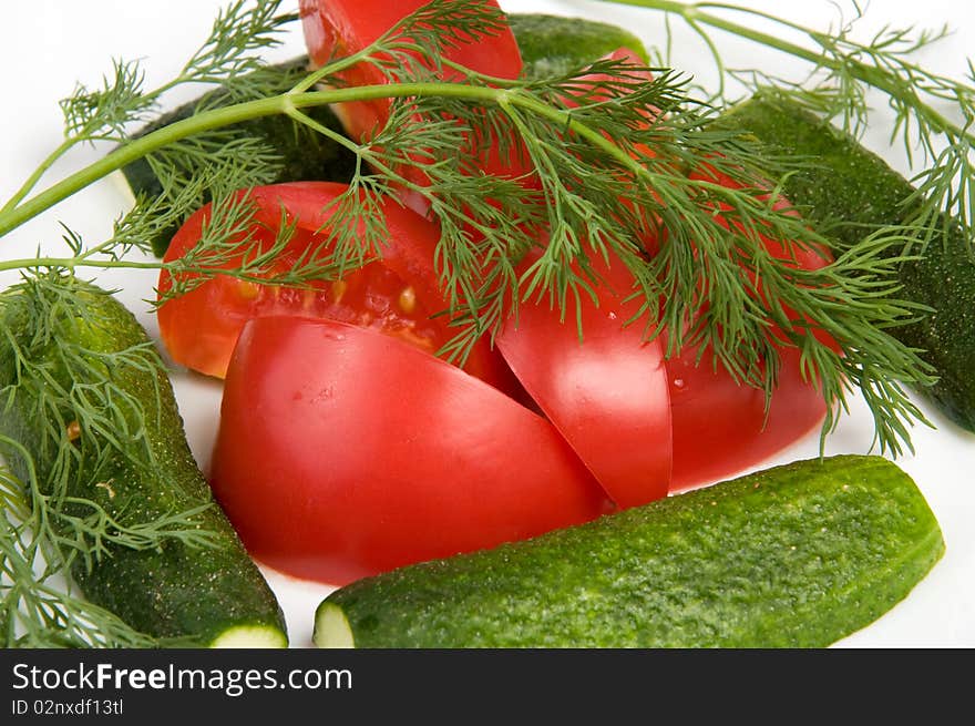 Macro of tomato and cucumber with dill. Macro of tomato and cucumber with dill