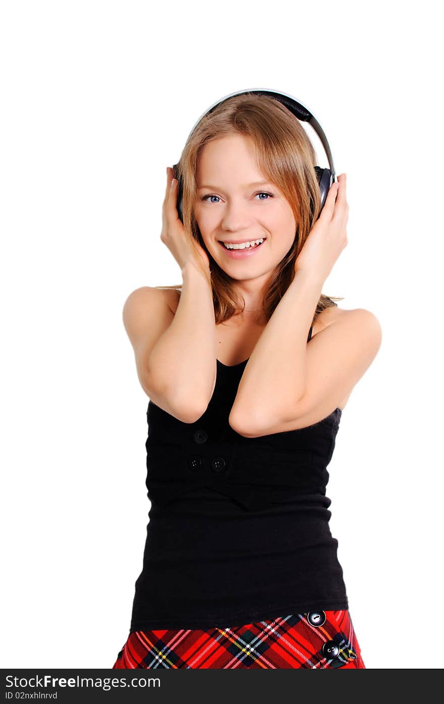 Pretty cheerful teenage girl listening to music. Pretty cheerful teenage girl listening to music