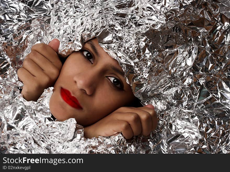 African beauty woman wrapped in foil. African beauty woman wrapped in foil