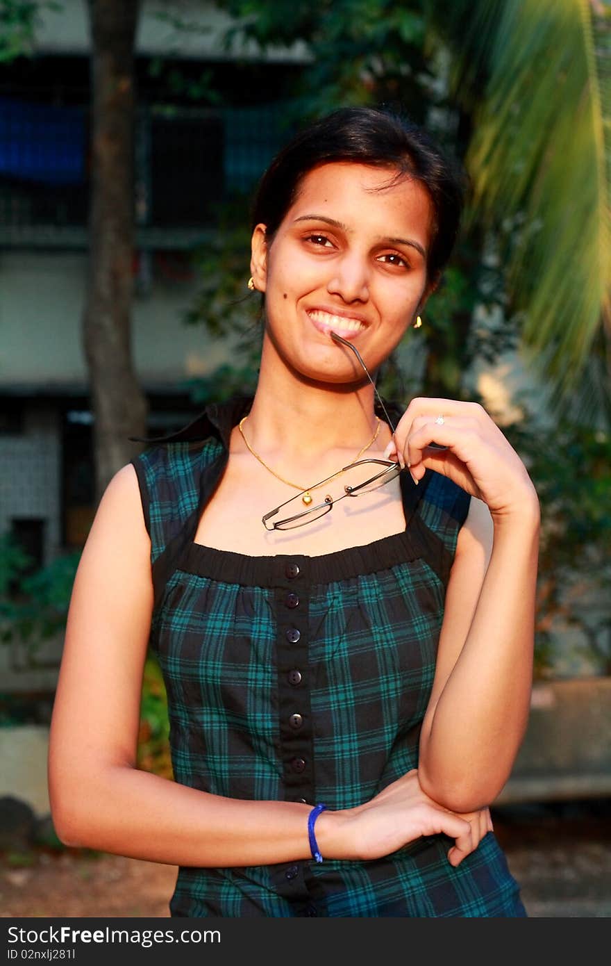 A smart Indian girl pleased to hear something in her praise. A smart Indian girl pleased to hear something in her praise.