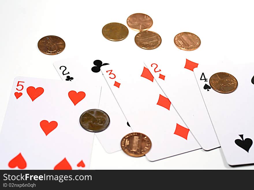 Five playing cards and pennies.